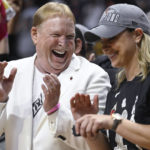 
              Las Vegas Aces owner Mark Davis, celebrates his team's win with Las Vegas Aces head coach Becky Hammon in the WNBA basketball finals against the Connecticut Sun, Sunday, Sept. 18, 2022, in Uncasville, Conn. (AP Photo/Jessica Hill)
            