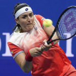 
              Ons Jabeur, of Tunisia, returns a shot to Caroline Garcia, of France, during the semifinals of the U.S. Open tennis championships, Thursday, Sept. 8, 2022, in New York. (AP Photo/Frank Franklin II)
            