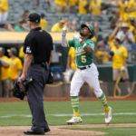 
              Oakland Athletics' Tony Kemp (5) celebrates after hitting a solo home run against the Chicago White Sox during the sixth inning of a baseball game in Oakland, Calif., Sunday, Sept. 11, 2022. (AP Photo/Godofredo A. Vásquez)
            