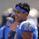 
              UCLA running back Zach Charbonnet stands on the sidelines during the second half of an NCAA college football game against Bowling Green Saturday, Sept. 3, 2022, in Pasadena, Calif. (AP Photo/Mark J. Terrill)
            