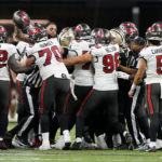 
              Officials break a brawl between the New Orleans Saints and the Tampa Bay Buccaneers during the second half of an NFL football game in New Orleans, Sunday, Sept. 18, 2022. (AP Photo/Gerald Herbert)
            