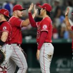 
              Los Angeles Angels' Mike Ford, from left, Mike Trout, Shohei Ohtani (17) and Patrick Sandoval (43) celebrate the team's 5-2 win in a baseball game against the Texas Rangers in Arlington, Texas, Tuesday, Sept. 20, 2022. (AP Photo/Tony Gutierrez)
            