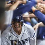 
              Tampa Bay Rays' Yu Chang celebrates in the dugout after hitting a home run against the Boston Red Sox during the sixth inning of a baseball game Tuesday, Sept. 6, 2022, in St. Petersburg, Fla. (AP Photo/Mike Carlson)
            