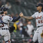 
              Detroit Tigers catcher Eric Haase and relief pitcher Gregory Soto clasp hands after the team's 3-2 win in a baseball game against the Baltimore Orioles, Tuesday, Sept. 20, 2022, in Baltimore. (AP Photo/Jess Rapfogel)
            