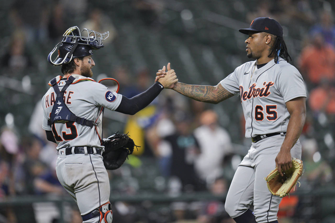 Detroit Tigers catcher Eric Haase and relief pitcher Gregory Soto clasp hands after the team's 3-2 ...