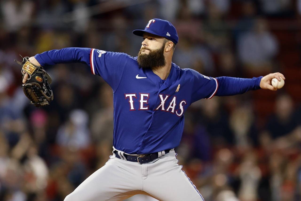Texas Rangers' Dallas Keuchel pitches during the first inning of a baseball game against the Boston...