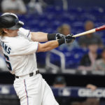 
              Miami Marlins' Luke Williams hits a single during the third inning of a baseball game against the Philadelphia Phillies, Tuesday, Sept. 13, 2022, in Miami. (AP Photo/Lynne Sladky)
            