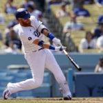 
              Los Angeles Dodgers' Justin Turner connects for a three-run home run during the fifth inning of a baseball game against the San Francisco Giants, Wednesday, Sept. 7, 2022, in Los Angeles. (AP Photo/Marcio Jose Sanchez)
            