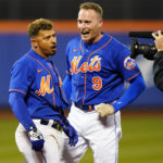 
              New York Mets' Eduardo Escobar, left, celebrates with teammate Brandon Nimmo after a baseball game against the Miami Marlins Wednesday, Sept. 28, 2022, in New York. The Mets won 5-4. (AP Photo/Frank Franklin II)
            