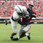 
              Samford cornerback Hakeem Johnson (16) breaks up a pass intended for Georgia wide receiver Dillon Bell (86) during the second half of an NCAA college football game, Saturday, Sept. 10, 2022 in Athens, Ga. (AP Photo/John Bazemore)
            