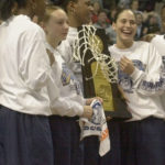 
              FILE - Sue Bird, right, and teammates, from left, Swin Cash, Maria Conlon, Asjha Jones, hold the NCAA Division I women's basketball championship trophy at a homecoming celebration in Storrs, Conn., April 1, 2002. Bird captured two college national titles at UConn, four WNBA championships with the Seattle Storm and five Olympic gold medals with the U.S. (AP Photo/Bob Child, File)
            