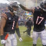 
              Chicago Bears' Justin Fields and Ihmir Smith-Marsette celebrate after an NFL football game against the San Francisco 49ers Sunday, Sept. 11, 2022, in Chicago. The Bears won 19-10. (AP Photo/Nam Y. Huh)
            