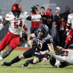 
              Texas Tech's Bryce Ramirez (54) combines on a sack of North Carolina State's Devin Leary (13) with teammate Tyree Wilson (19) during the first half of an NCAA college football game in Raleigh, N.C., Saturday, Sept. 17, 2022. (AP Photo/Karl B DeBlaker)
            
