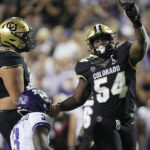 
              Colorado defensive end Terrance Lang, right, celebrates after tackling TCU running back Emari Demercado for a loss in the second half of an NCAA college football game Friday, Sept. 2, 2022, in Boulder, Colo. (AP Photo/David Zalubowski)
            