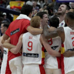 
              The players of team Spain celebrate winning the Eurobasket final basketball match between Spain and France in Berlin, Germany, Sunday, Sept. 18, 2022. Spain defeated France by 88-76. (AP Photo/Michael Sohn)
            