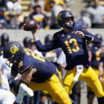 
              California quarterback Jack Plummer (13) throws a pass against UC Davis during the first half of an NCAA college football game in Berkeley, Calif., Saturday, Sept. 3, 2022. (AP Photo/Godofredo A. Vásquez)
            