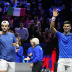 
              Team Europe's Novak Djokovic and Matteo Berrettini celebrate after winning a match against Team World's Jack Sock and Alex de Minaur on second day of the Laver Cup tennis tournament at the O2 in London, Saturday, Sept. 24, 2022. (AP Photo/Kin Cheung)
            