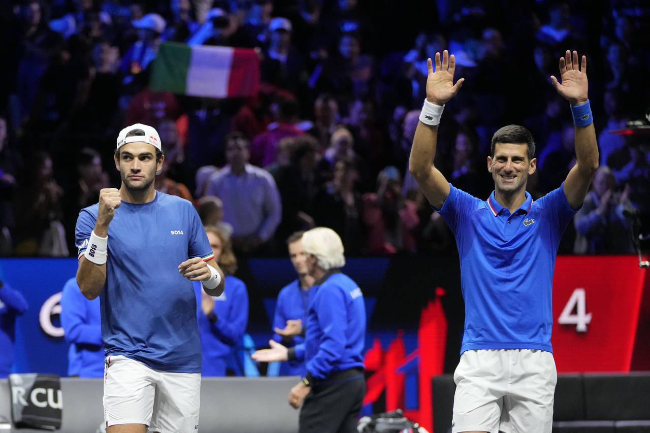 Team Europe's Novak Djokovic and Matteo Berrettini celebrate after winning a match against Team Wor...