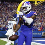 
              Buffalo Bills wide receiver Stefon Diggs gestures to fans after catching a pass for a touchdown in front of Tennessee Titans' Tre Avery (30) during the second half of an NFL football game Monday, Sept. 19, 2022, in Orchard Park, N.Y. (AP Photo/Jeffrey T. Barnes)
            