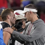 
              Southern California head coach Lincoln Riley, right, speaks to Fresno State quarterback Jake Haener following an NCAA college football game Saturday, Sept. 17, 2022, in Los Angeles. Haener was injured during the second half. (AP Photo/Mark J. Terrill)
            