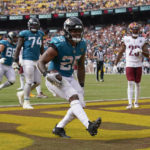 
              Jacksonville Jaguars running back James Robinson (25) scoring a touchdown against the Washington Commanders during the second half of an NFL football game, Sunday, Sept. 11, 2022, in Landover, Md. (AP Photo/Patrick Semansky)
            