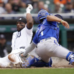 
              Detroit Tigers left fielder Akil Baddoo slides safely into home plate to score ahead of the tag by Kansas City Royals catcher MJ Melendez (1) in the fifth inning of a baseball game in Detroit, Thursday, Sept. 29, 2022. (AP Photo/Paul Sancya)
            