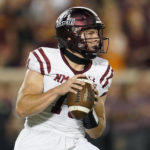 
              New Mexico State quarterback Diego Pavia looks to pass the ball during the first half of an NCAA college football game against Minnesota, Thursday, Sept. 1, 2022, in Minneapolis. (AP Photo/Abbie Parr)
            