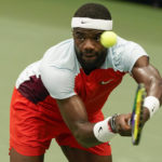 
              Frances Tiafoe, of the United States, returns a shot to Andrey Rublev, of Russia, during the quarterfinals of the U.S. Open tennis championships, Wednesday, Sept. 7, 2022, in New York. (AP Photo/Seth Wenig)
            