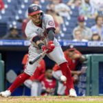 
              Washington Nationals' Joey Meneses hits a single during the fourth inning of a baseball game against the Philadelphia Phillies, Sunday, Sept. 11, 2022, in Philadelphia. (AP Photo/Laurence Kesterson)
            