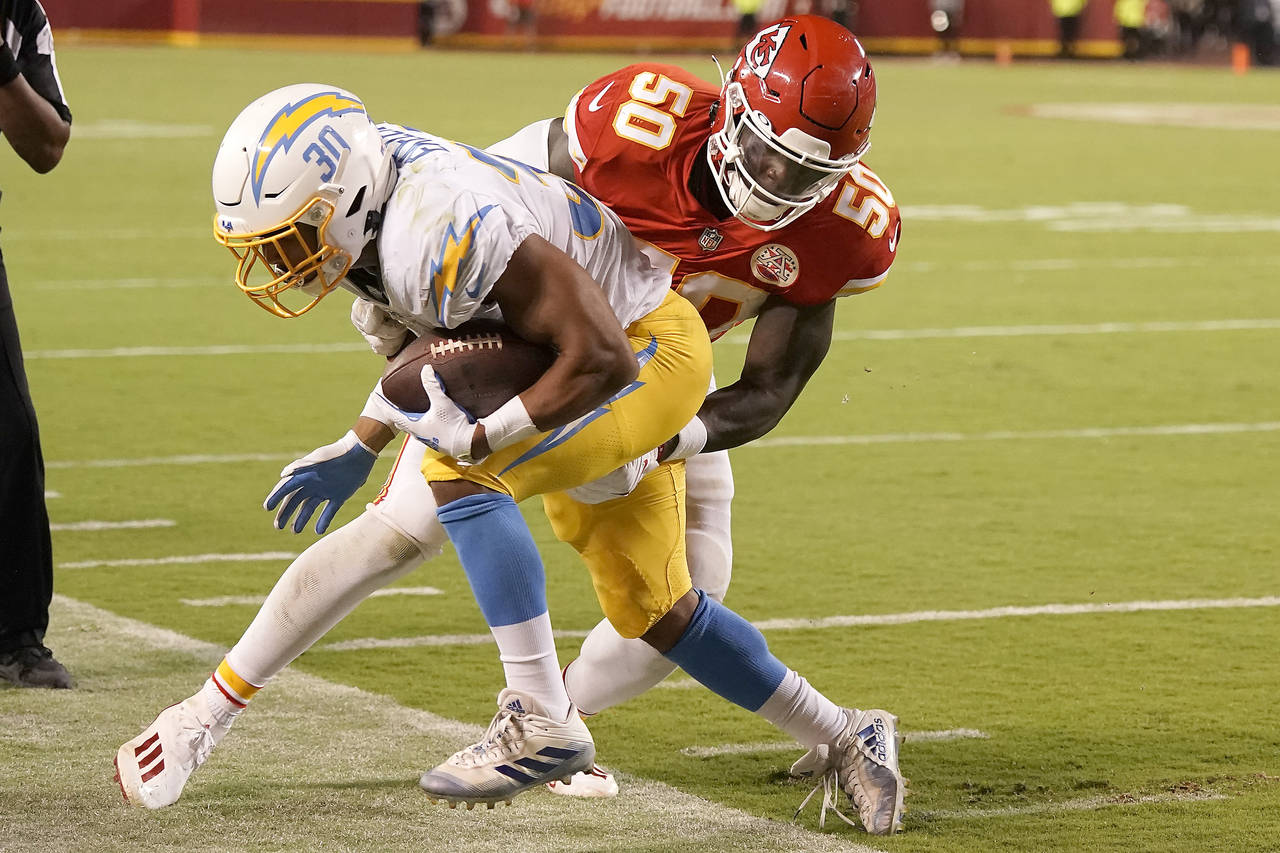 Kansas City Chiefs linebacker Willie Gay (50) tackles Los Angeles Chargers running back Austin Ekel...