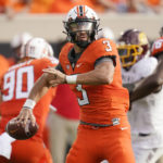 
              Oklahoma State quarterback Spencer Sanders (3) looks for a receiver during the first half of the team's NCAA college football game against Central Michigan, Thursday, Sept. 1, 2022, in Stillwater, Okla. (AP Photo/Sue Ogrocki)
            
