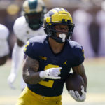 
              Michigan running back Blake Corum rushes during the first half of an NCAA college football game against Colorado State, Saturday, Sept. 3, 2022, in Ann Arbor, Mich. (AP Photo/Carlos Osorio)
            