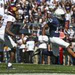 
              Penn State running back Kaytron Allen (13) scores a touchdown while being chased by Central Michigan defensive back Trey Jones (3) during the first half of an NCAA college football game, Saturday, Sept. 24, 2022, in State College, Pa. (AP Photo/Barry Reeger)
            