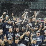 
              The New York Yankees pose for team photographs after defeating the Toronto Blue Jays in a baseball game to clinch the AL East, in Toronto on Tuesday, Sept. 27, 2022. (Nathan Denette/The Canadian Press via AP)
            