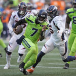 
              Seattle Seahawks quarterback Geno Smith (7) scrambles against the Denver Broncos during the first half of an NFL football game, Monday, Sept. 12, 2022, in Seattle. (AP Photo/Stephen Brashear)
            