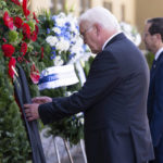 
              German President Frank-Walter Steinmeier, left, and Israeli President Isaac Herzog, right, attend a wreath laying ceremony to commemorate the victims of the attack by Palestinian militants on the 1972 Munich Olympics in Fuerstenfeldbruck near Munich, Germany, Monday, Sept. 5, 2002. The German and Israeli presidents are to join relatives of the 11 Israeli athletes killed in the attack by Palestinian militants on the commemoration event. (Sven Hoppe/dpa via AP)
            