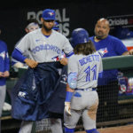 
              Toronto Blue Jays' Bo Bichette, right, is greeted near the dugout by Lourdes Gurriel Jr. after hitting a solo home run against the Baltimore Orioles during the seventh inning of the second game of a baseball doubleheader, Monday, Sept. 5, 2022, in Baltimore. (AP Photo/Julio Cortez)
            