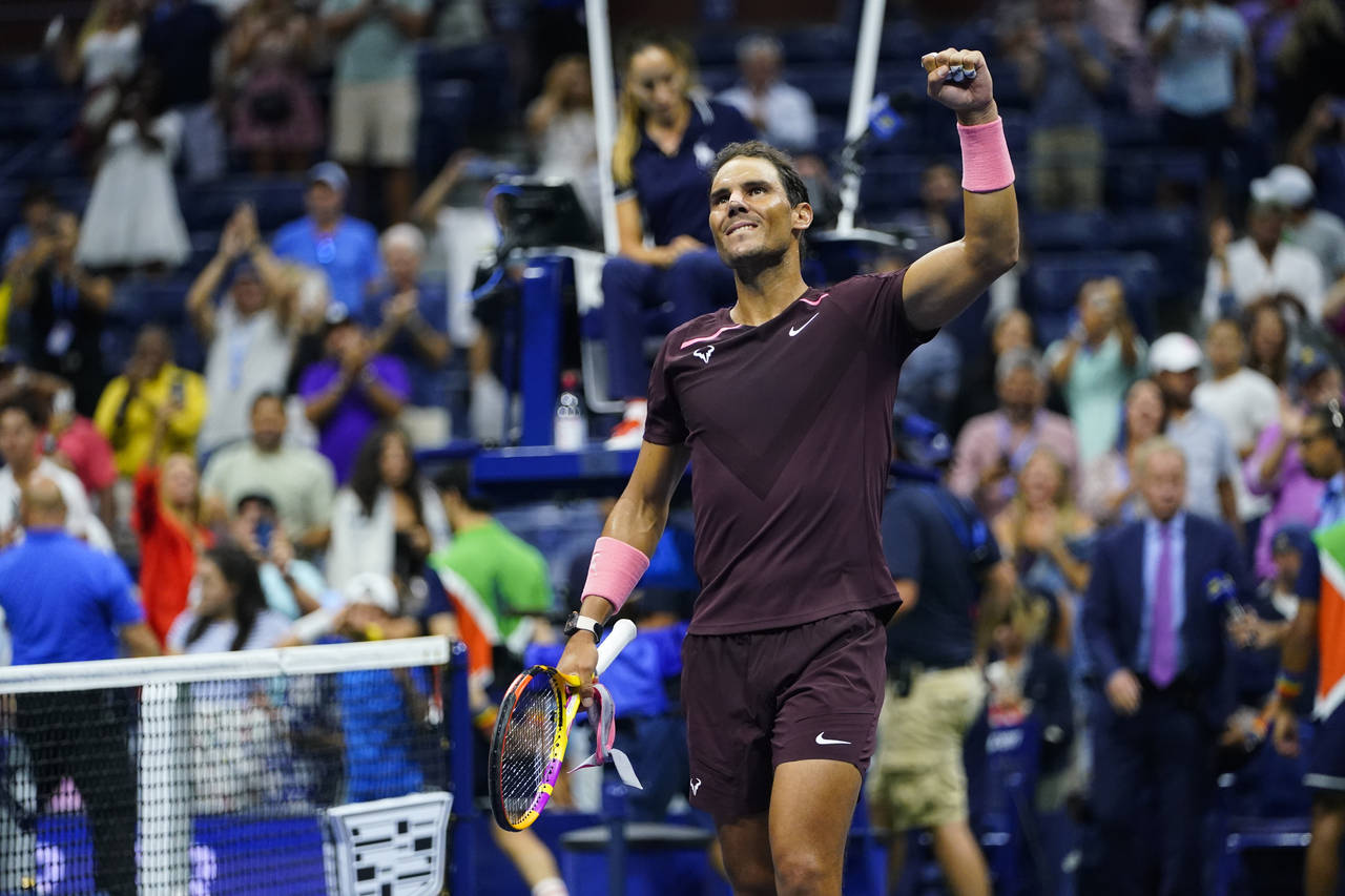 Rafael Nadal, of Spain, celebrates after defeating Fabio Fognini, of Italy, during the second round...