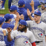 
              Toronto Blue Jays' Vladimir Guerrero Jr., bottom right, celebrates with teammates after they defeated the Pittsburgh Pirates in a baseball game, Sunday, Sept. 4, 2022, in Pittsburgh. (AP Photo/Keith Srakocic)
            