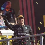
              Mercedes driver George Russell of Britain celebrates on the podium after placing third at the Italian Grand Prix race at the Monza racetrack, in Monza, Italy, Sunday, Sept. 11, 2022. (AP Photo/Antonio Calanni)
            