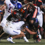 
              Oregon State running back Damien Martinez (6) is brought down by Boise State cornerback Kaonohi Kaniho during the first half of an NCAA college football game Saturday, Sept. 3, 2022, in Corvallis, Ore. (AP Photo/Amanda Loman)
            