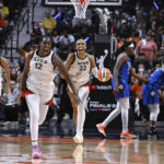 
              The Las Vegas Aces celebrate their win in the WNBA basketball finals against the Connecticut Sun, Sunday, Sept. 18, 2022, in Uncasville, Conn. (AP Photo/Jessica Hill)
            