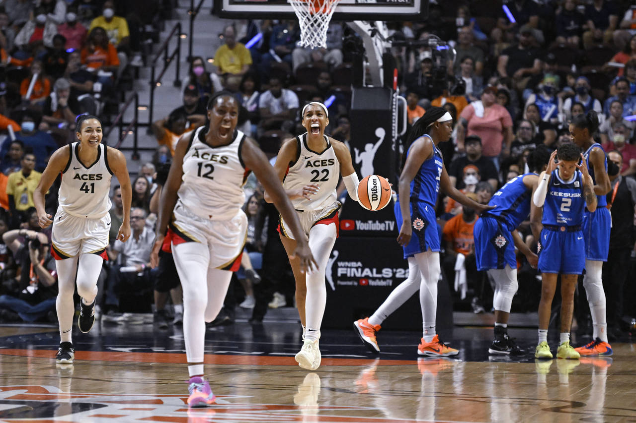 The Las Vegas Aces celebrate their win in the WNBA basketball finals against the Connecticut Sun, S...