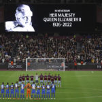 
              Team players stand on the pitch during minutes silence following the death of Queen Elizabeth II prior the Group B Europa Conference League soccer match between West Ham and FCSB Steaua Bucharest at London Stadium in London, Thursday, Sept. 8, 2022. (AP Photo/Ian Walton)
            