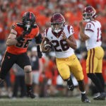 
              Southern California running back Travis Dye rushes during the first half of the team's NCAA college football game against Oregon State on Saturday, Sept. 24, 2022, in Corvallis, Ore. (AP Photo/Amanda Loman)
            