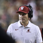 
              Washington State coach Jake Dickert watches during the first half of the team's NCAA college football game against Idaho, Saturday, Sept. 3, 2022, in Pullman, Wash. (AP Photo/Young Kwak)
            