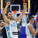 
              Slovenia's Mike Tobey, front, celebrates after the Eurobasket round of sixteen basketball match between Slovenia and Belgium in Berlin, Germany, Saturday, Sept. 10, 2022. (AP Photo/Michael Sohn)
            