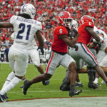 
              Georgia running back Kenny McIntosh (6) runs in for a touchdown during the first half of an NCAA college football game against Samford, Saturday, Sept. 10, 2022, in Athens, Ga. (AP Photo/John Bazemore)
            