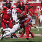 
              Southern Utah safety George Ramirez, rear, tackles Utah running back Chris Curry during the first half of an NCAA college football game, Saturday, Sept. 10, 2022, in Salt Lake City. (AP Photo/Rick Bowmer)
            