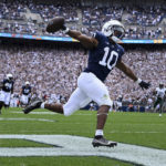 
              Penn State running back Nicholas Singleton (10) celebrates as he scores on a 70-yard touchdown run in the first half of an NCAA college football game, Saturday, Sept. 10, 2022, in State College, Pa. (AP Photo/Barry Reeger)
            